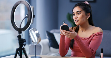 Ring light, woman and influencer with makeup brush for live streaming, beauty or tutorial. Cosmetics, foundation and person recording video on phone for aesthetic, glow and broadcast guide in home