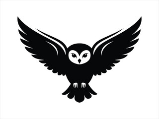 Black silhouette of an owl in flight with wings spread wide open