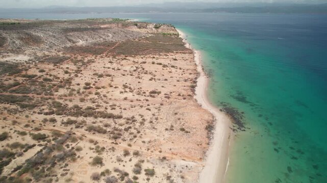 Aerial view of Araya coastline, sandy beach meets clear sea waters
