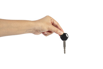 A black motorcycle key in a hand against a transparent background.