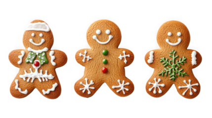 Three festive gingerbread men cookies decorated with white green and red icing for holidays