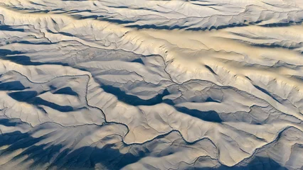 Lunar landscape. Drought and dry riverbeds. Aerial view of desert structures. Global warming and climate change. Universal use. General shots. © Michal