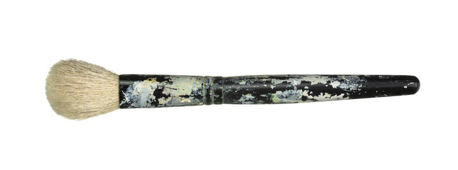 Old paint brush with worn handle isolated on white background.