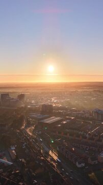 Atmospheric Sunrise Cityscape With Fog and Chimney Steam. Basingstoke. UK