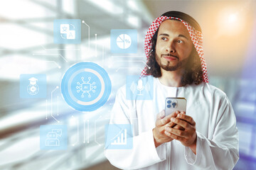 Professional man using smartphone in modern office with digital technology symbols around him