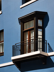 Fototapeta premium Close-up of Real estate, city balcony, dark wood window frames