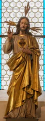 Wandcirkels plexiglas Jezus Christus SALZBURG, AUSTIRA - SEPTEMBER 7, 2025: The carved polychrome statue of Heart of Jesus in the church Franziskanerkirche by Karl Platzer (cca 1950).  © Renáta Sedmáková