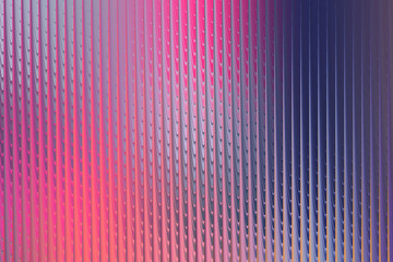 A mesmerizing display of refracted light through textured glass, creating a captivating dance of pink, purple, and blue hues with vertical lines