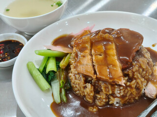 Side view of red pork and crispy pork rice on the table. Thai food