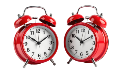 Two shiny red alarm clocks, face forward, showing different times, sitting side-by-side on a black background