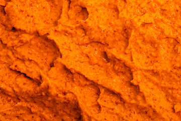 Orange yogurt ice cream with fresh fruits and berries, papaya, grapefruit, pumpkin, persimmon. Smoothie texture. Fruit yogurt ice cream. Delicious sweet dessert close-up as a background.