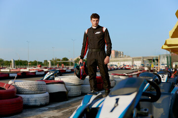Young race car driver preparing for karting competition © Nomad_Soul