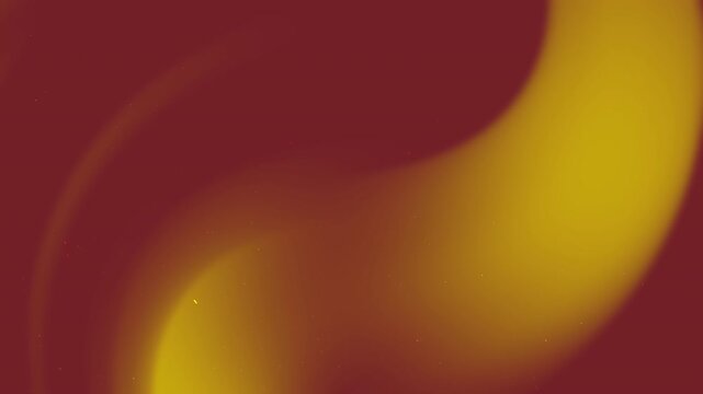 Abstract blurred image in shades of gold and maroon suitable for backgrounds, presentations, design projects, website headers, social media posts.