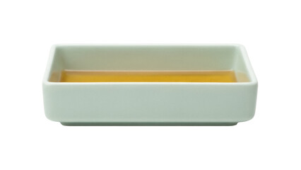 Light green square bowl with yellow liquid isolated PNG, minimalist tableware for food presentation and culinary design projects