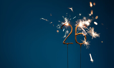 26 years celebration festive background with copy space made with Bengal fires in the form of number Twenty six.