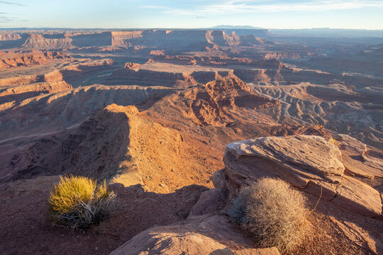 Dead Horse Point State Park in San Juan County, Utah, dramatic view of the Colorado River and Canyonlands National Park in Utah, Page, USA. Deserts, rocks, ledges, and mountains. Beautiful sunset - Powered by Adobe
