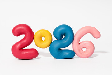 The numbers 2026 made of plasticine on a white background.