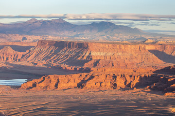 Dead Horse Point State Park in San Juan County, Utah, dramatic view of the Colorado River and Canyonlands National Park in Utah, Page, USA. Deserts, rocks, ledges, and mountains. Beautiful sunset
