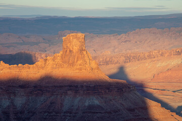 Dead Horse Point State Park in San Juan County, Utah, dramatic view of the Colorado River and Canyonlands National Park in Utah, Page, USA. Deserts, rocks, ledges, and mountains. Beautiful sunset