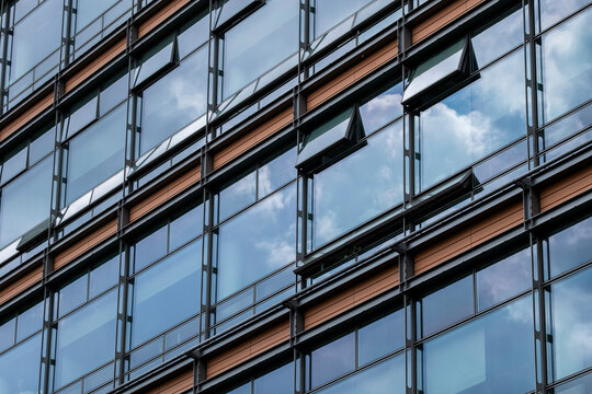 Corporate architecture background featuring modern office building glass facade pattern and abstract geometric lines