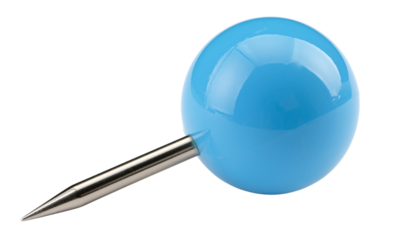 A blue push pin and a stainless steel spoon are isolated on a clean white background among various metal kitchen utensils and plastic cooking equipment