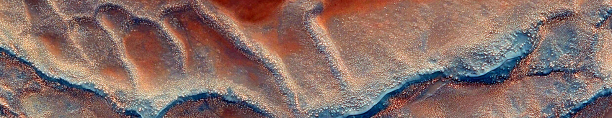 Abstract panoramic background with swirling copper and teal fluid ink textures