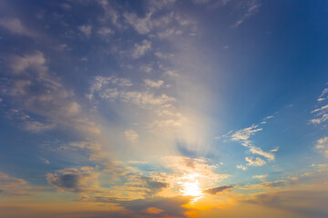 dramatic sunset on the blue cloudy sky background