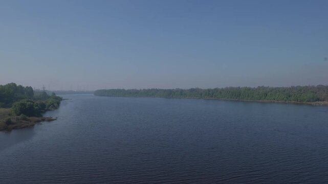 Diu, Gujarat, INDIA- 29th January 2025- Wide Angle shot of Tapi River flowing calmly through Diu and Daman.
