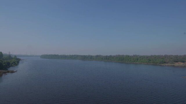 Diu, Gujarat, INDIA- 29th January 2025- Wide Angle shot of Tapi River flowing calmly through Diu and Daman.