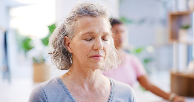 Yoga class, mature woman and meditation for mindfulness, fitness or breathing exercise for peace. Yogi, spiritual wellness and person with friends in studio, zen or holistic health with balance - Powered by Adobe