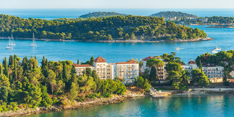 Panorama of the seaside town of Rovinj from the tower of the Catholic Church of Saint Euphemia in Croatia, surrounding islands in the sea, view at sunset.