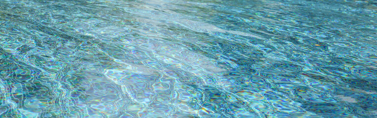 Swimming pool with blue crystal clear water surface and ripple wave background