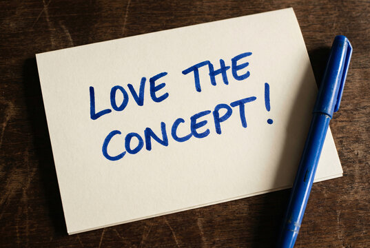 Naklejki Love the concept handwritten quote card on dark wooden desk, inspirational feedback message for creative ideas.