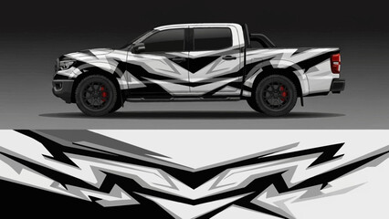 Sleek pickup truck with bold black and white abstract wrap design.