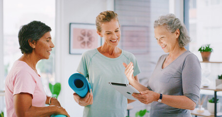 Yoga class, tablet and yogi with people in studio, check registration info or digital enrolment. Membership, smile or mature women with tech to review sign up sheet, online record or application form