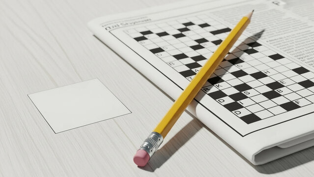Pencil beside crossword in newspaper on light wooden surface  