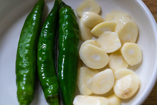 fresh chili pepers and garlic slices