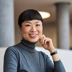 Portrait of a group of young business people having a meeting in the office. Teamwork and success concept, portrait of a smart young businesswoman using a laptop