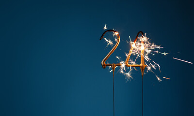 24 years celebration festive background with copy space made with Bengal fires in the form of number Twenty four.