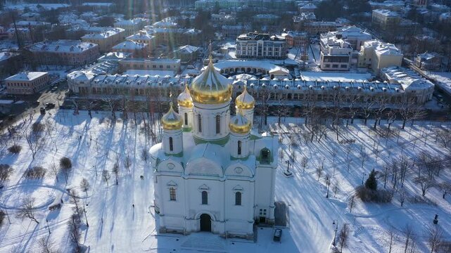 High angle aerial drone view of Catherine Cathedral and snowy square in Pushkin on a sunny winter day.