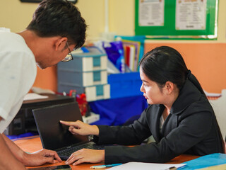 Asian Businesswoman working using laptop meeting online brainstorming finance goal planning and or talking businessman. Female leadership remote work. People mentorship young professionals. Knowledge 