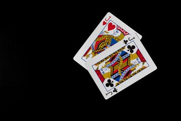 Two jacks playing cards isolated on black background