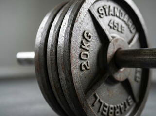 Close-Up of Iron Barbell Plates in Gym Setting