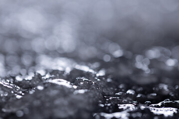 Snow close-up on a dark background. melting ice. 