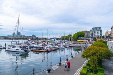 Tourists walking near marina in victoria, british columbia