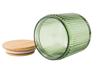 Isolated ribbed green glass jar with round wooden lid for home storage or food keeping