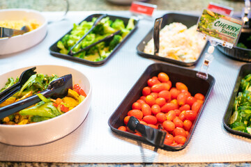 Various vegetable and fruit salad in salad bar shop