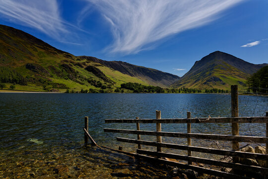 Waters edge at Buttermere in The Lake District of Cumbria England UK