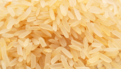 Pile of parboiled rice close up. Food background.