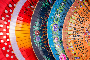 Colorful background of spanish fans in Andalusia, Spain